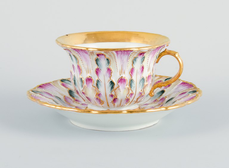 Antique Meissen chocolate cup.
Hand painted, gold decoration.