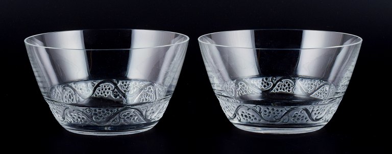 René Lalique, France. Two Phalsbourg fingerbowls in clear art glass with vines 
and grapes in relief.