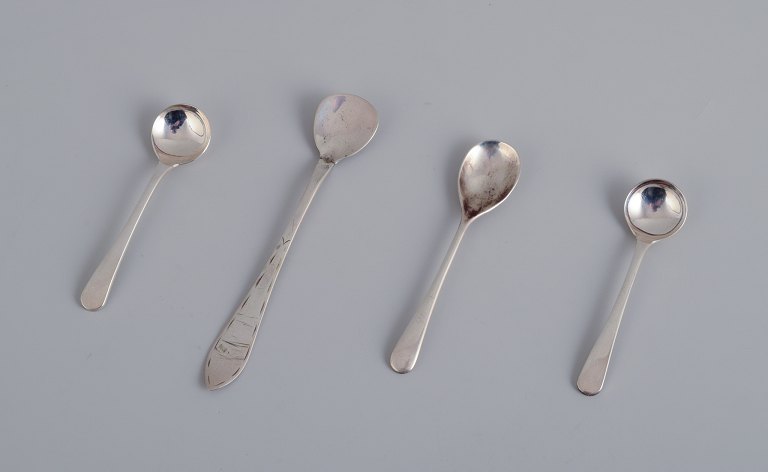 A set of four Scandinavian salt spoons in silver.