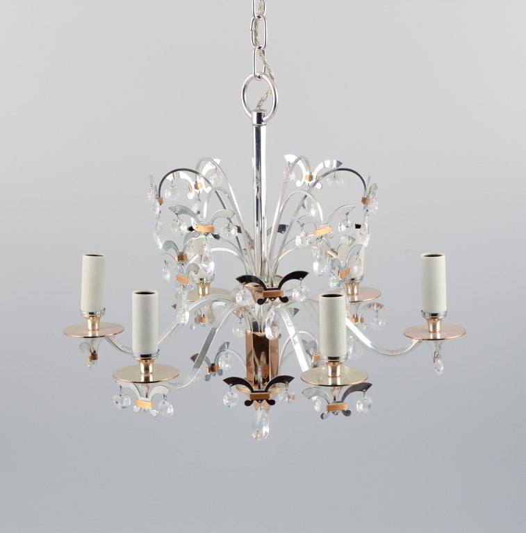Scandinavian design, metal chandelier with crystals.