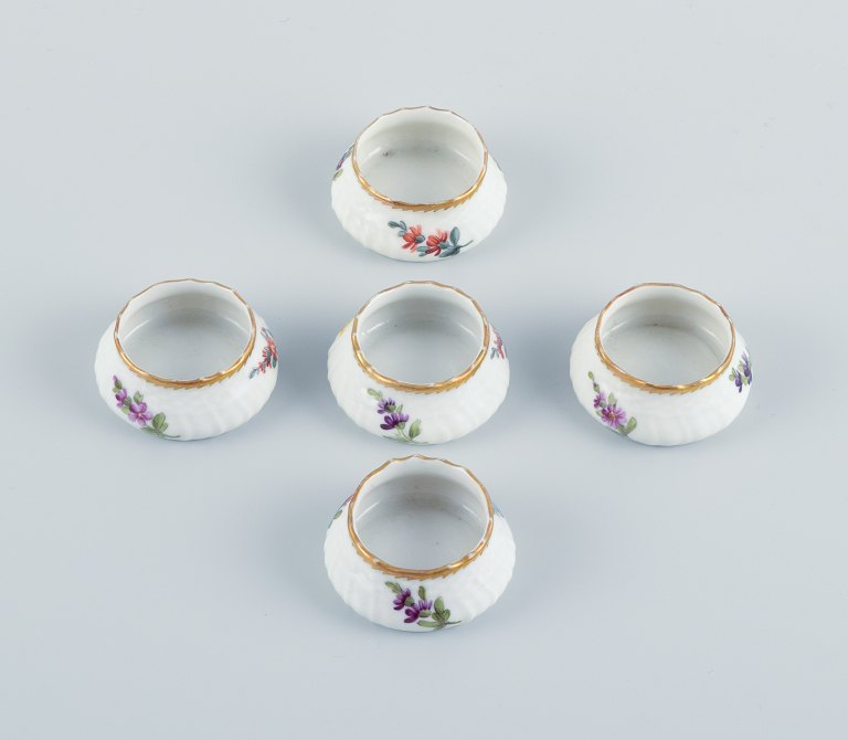 Royal Copenhagen, Saxon Flower.
A set of five salt vessels, hand painted with flowers and gold edge.