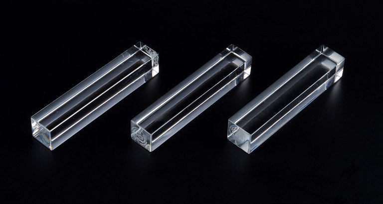 Baccarat, France, three art deco knife rests in clear glass.