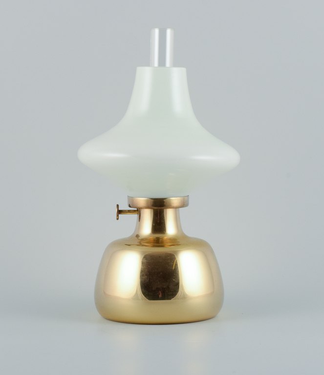 Henning Koppel for Louis Poulsen, Petronella oil lamp in brass with opaline 
glass shade.