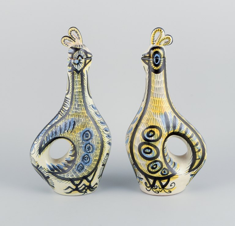 Jean Delima for Keraluc, Quimper, France, a pair of large faience pitchers 
shaped like roosters. In style of Picasso.