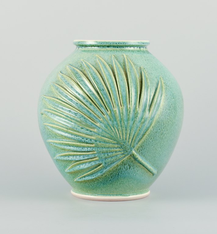 French ceramicist, large unique vase in green-blue glaze.
Designed with relief palm leaves.