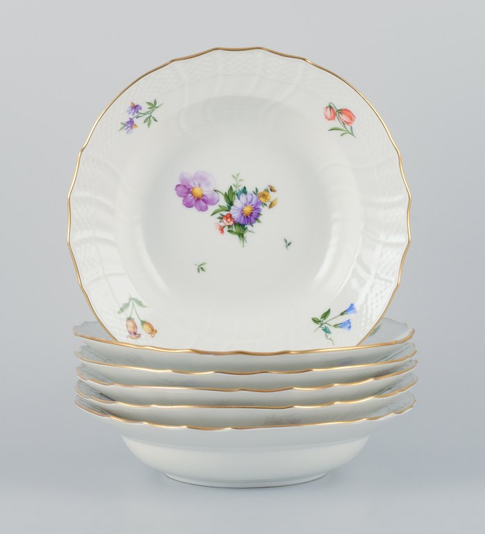 Royal Copenhagen, six Saxon Flower deep plates. Hand-painted with various 
polychrome flower motifs.