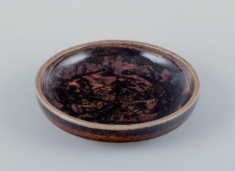 Nils Thorsson for Royal Copenhagen, unique ceramic bowl with abstract motif and 
glaze in brown shades.