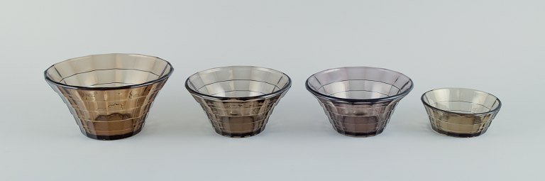 Simon Gate (1883-1945) for Orrefors/Sandvik, Sweden.
A set of four Art Deco bowls in smoked coloured pressed glass.