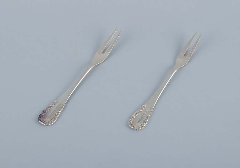 Georg Jensen, Viking, two cold meat forks/herring forks in 830 silver.