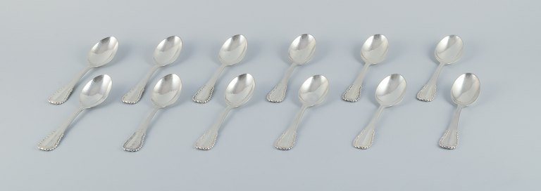 Georg Jensen, Viking, a set of twelve dessert spoons in sterling silver and 830 
silver.
