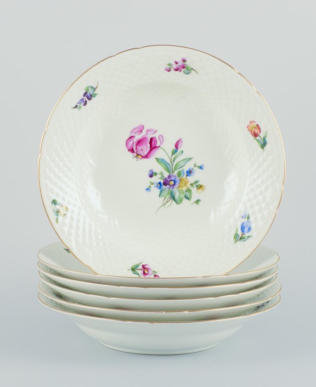 Bing & Grøndahl, Saxon Flower, a set of six deep plates hand-decorated with 
polychrome flowers and gold rim.