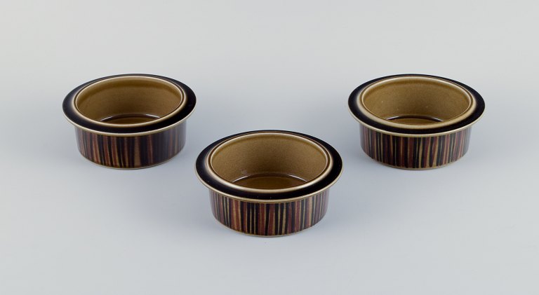 Gunvor Olin-Grönqvist for Arabia, "Cosmos," three bowls. Stoneware in a retro 
style. Glazed in green-brown tones.