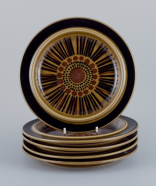 Gunvor Olin-Grönqvist for Arabia, "Cosmos", a set of five lunch plates in 
stoneware. Retro-style stoneware with green-brown glaze.