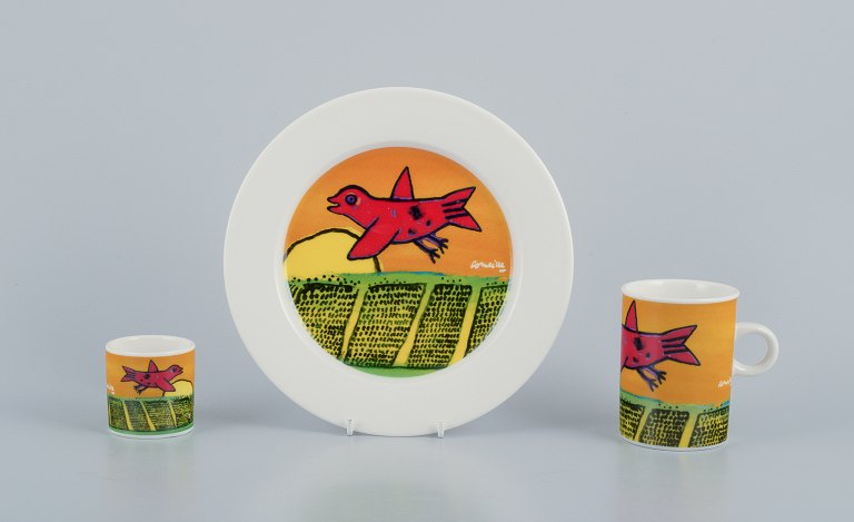 Corneille (Guillaume Cornelis van Beverloo), Dutch CoBrA artist (1922-2010). 
Coffee cup, plate, and egg cup in porcelain decorated with birds over a field 
with sunrise.