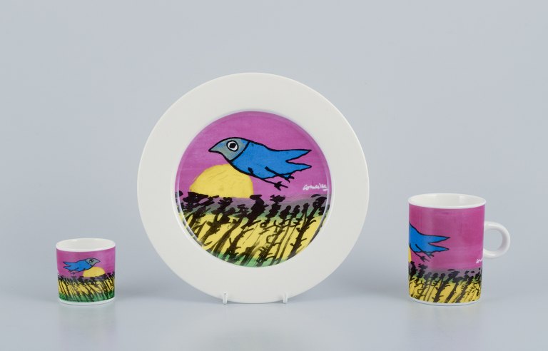 Corneille (Guillaume Cornelis van Beverloo), Dutch CoBrA artist (1922-2010). 
Coffee cup, plate, and egg cup in porcelain decorated with birds over a field 
with sunrise.