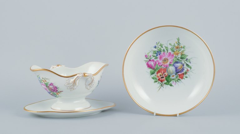 Bing & Grøndahl, a hand-painted sauceboat and bowl decorated with polychrome 
flowers.