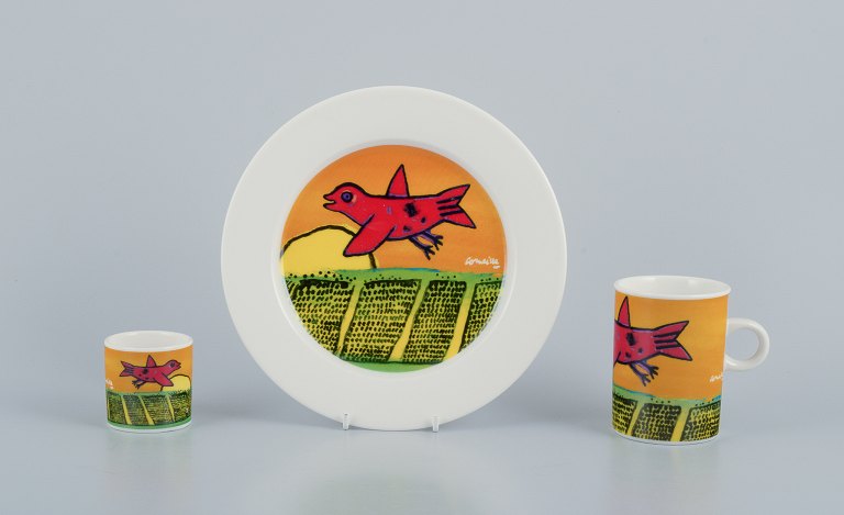 Corneille (Guillaume Cornelis van Beverloo), Dutch CoBrA artist (1922-2010). 
Coffee cup, plate, and egg cup in porcelain decorated with birds over a field in 
sunrise.