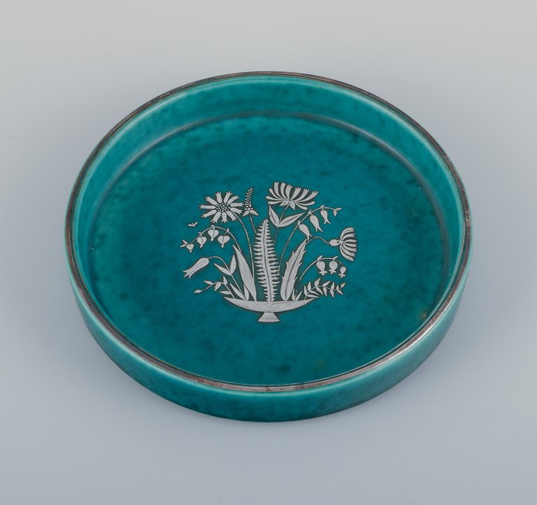Wilhelm Kåge for Gustavsberg, Sweden, low Art Deco ceramic bowl with silver 
decoration featuring a floral motif. From the "Argenta" series.