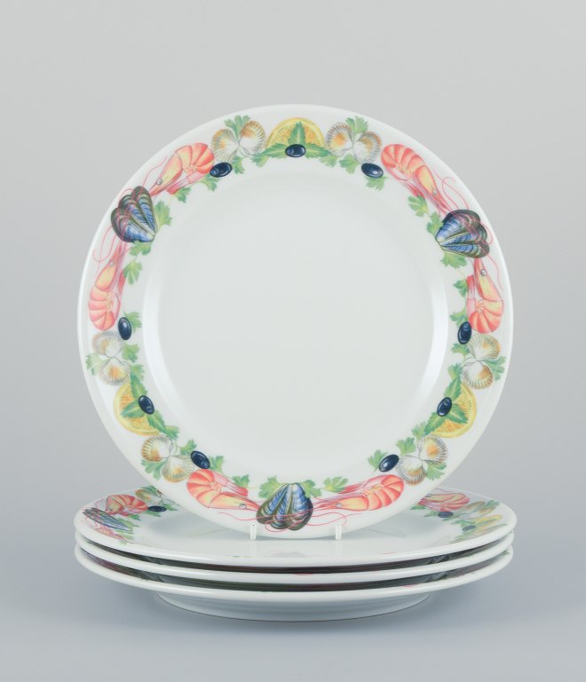Pillivuyt, France, a set of four large dinner plates in porcelain with seafood 
motif.