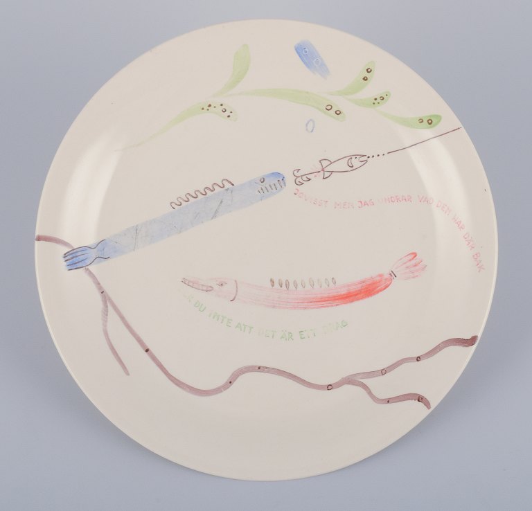 Stig Lindberg for Gustavsberg. "Löja" plate. Hand-painted with a fish motif. 
Satirical illustration with Swedish text.