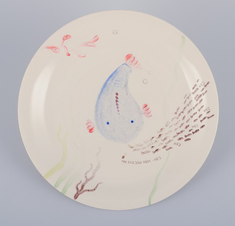 Stig Lindberg for Gustavsberg. "Löja" plate. Hand-painted with a fish motif. 
Satirical illustration with Swedish text.