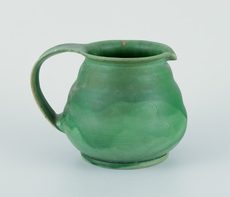 Kähler, Denmark. Ceramic pitcher.
Glaze in green tones.