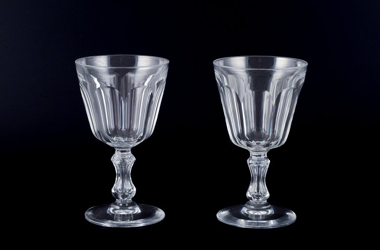 Val St. Lambert, Belgium, two "Lalaing" red wine glasses in clear faceted cut 
crystal glass.