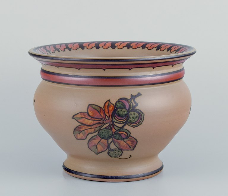 Hjorth, island of Bornholm, Denmark. Large ceramic jar. Hand-painted with floral 
motifs.