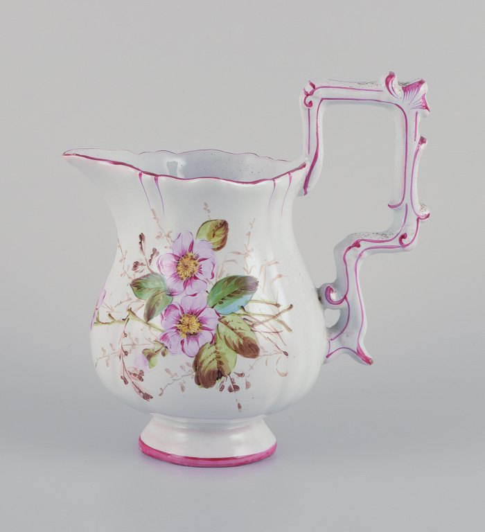 Emile Gallé (style of). Pitcher in faience with motifs of flowers and insects.