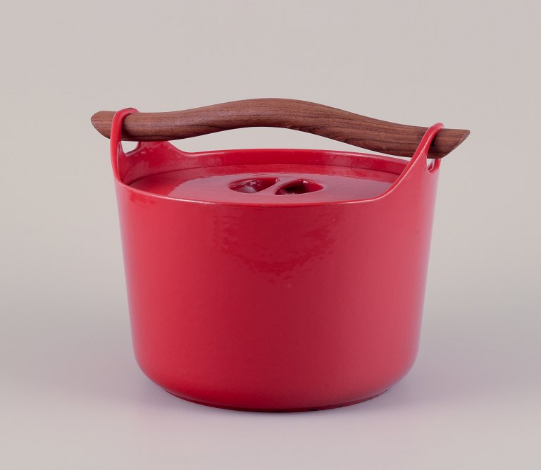 Timo Sarpaneva for Rosenlew, Finland. Cast iron pot in red enamel with a wooden 
handle.