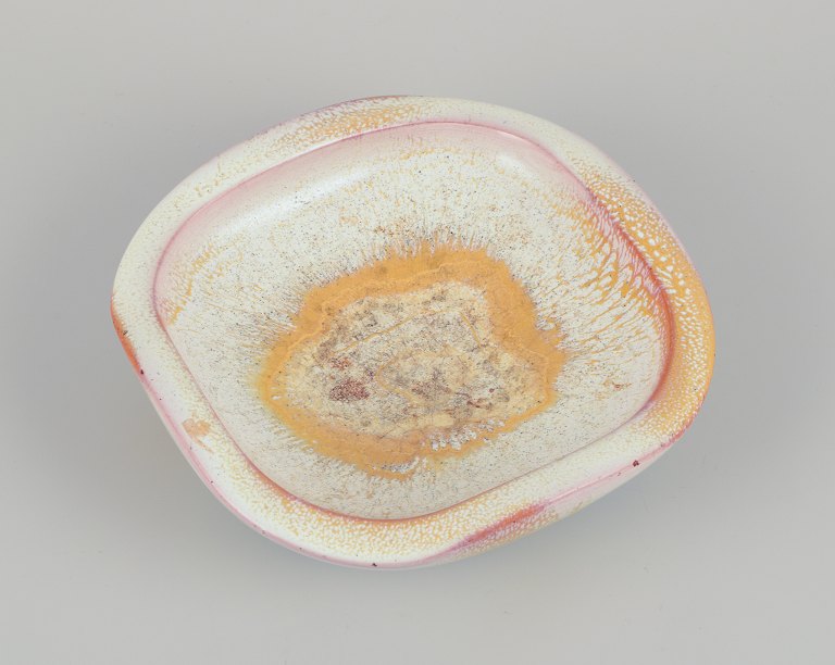 Anna-Lisa Thomson (1905-1952) for Upsala Ekeby, Sweden. Low ceramic bowl with 
yellow and sand-colored glaze.