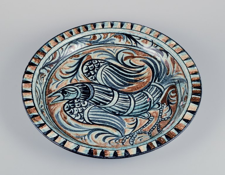 Sten Lindgren, Swedish ceramist for Porches Algarve, Portugal. 
Colossal unique ceramic bowl with a bird motif. Polychrome glaze.