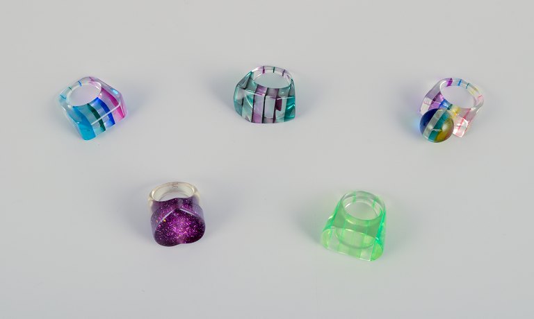French jewelry artist. Five designer rings in plastic. Striped design with 
various colors.