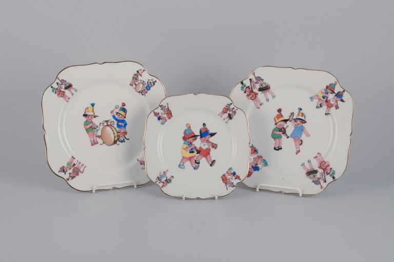 Limoges Porcelaine, France. Three porcelain plates with motifs of child 
musicians.