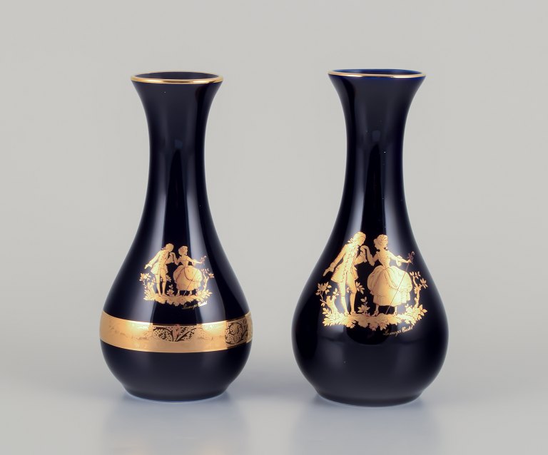 Limoges, France. Two porcelain vases decorated with 22-karat gold leaf and 
beautiful royal blue glaze. Scène galante.