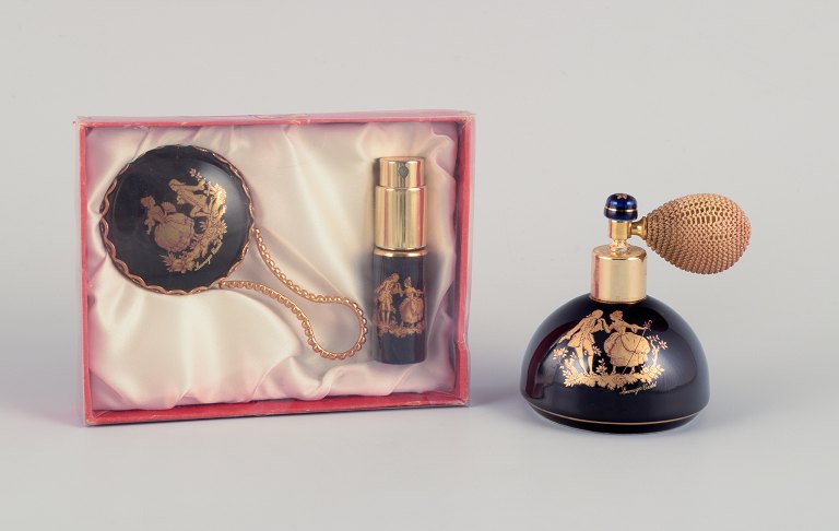 Limoges, France. Two porcelain perfume atomizers and a makeup mirror, decorated 
with 22-karat gold leaf and a beautiful royal blue glaze. Scène galante.