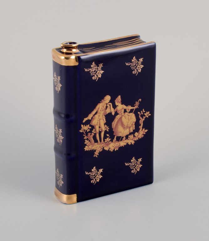 Limoges, France. Porcelain "hip flask" shaped like a book decorated with 
22-karat gold leaf and beautiful royal blue glaze. Scène galante.