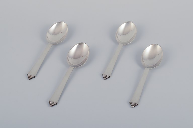 Georg Jensen Pyramid, four dining spoons in sterling silver.