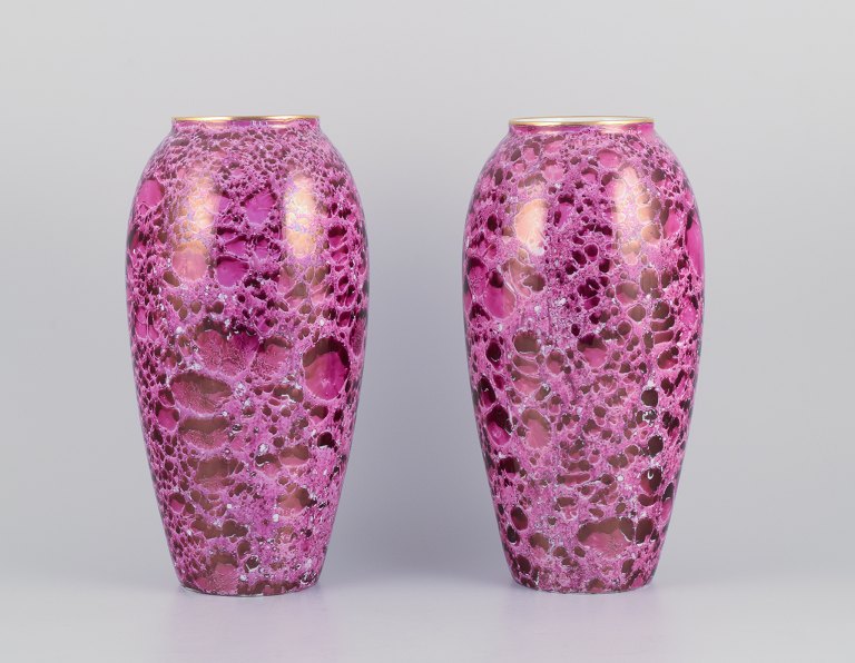 Limoges, France. A pair of large Art Deco porcelain vases.
Hand-decorated with glaze in shades of purple and gold rim.