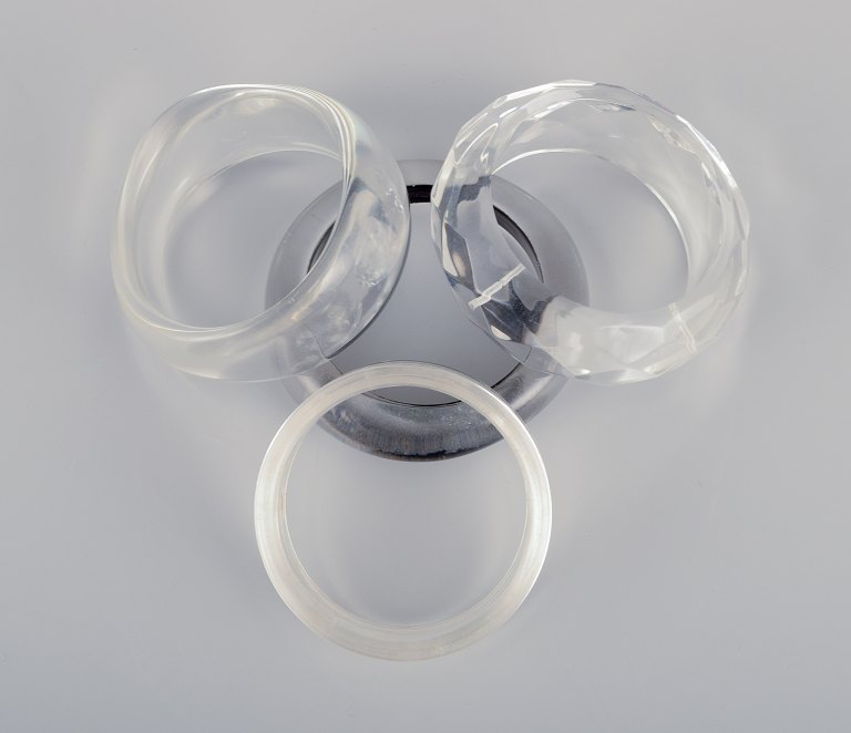 French jewelry designer.
Four bracelets in clear plastic.