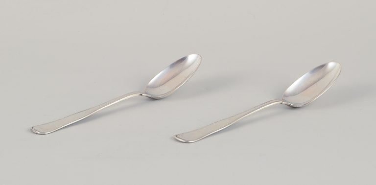 Swedish silversmith, two "Old Danish" pattern dessert spoons.