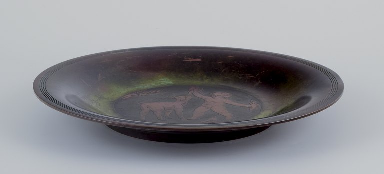 Just Andersen. Rare bronze dish.Boy and goat kid.