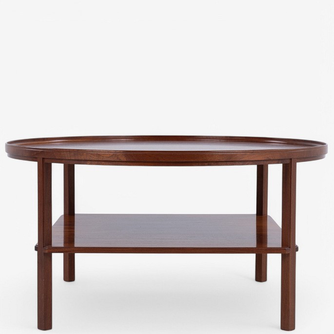 Kaare Klint / Rud. Rasmussen
Model KK 6687 - Coffee table in lacquered mahogany with shelf and moulded edge. 
Labelled from manufacturer.
1 pc. in stock
