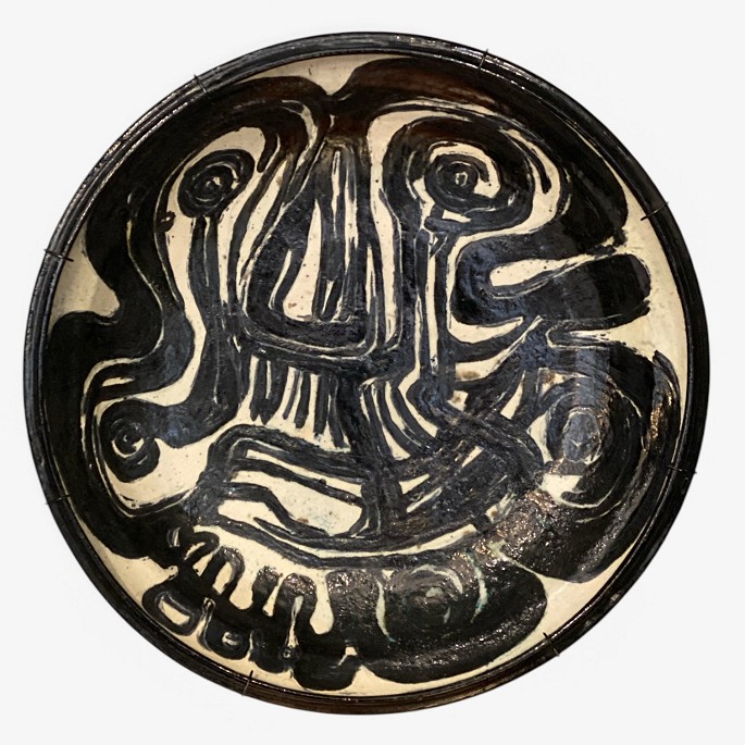 Birte Weggerby.
Large stoneware wall dish with black and white glaze and wall mount. Signed by 
the artist. 1970.
1 pc. in stock
