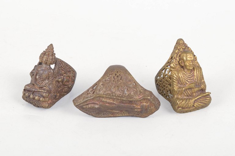 Set of three Oriental bronze finger rings.